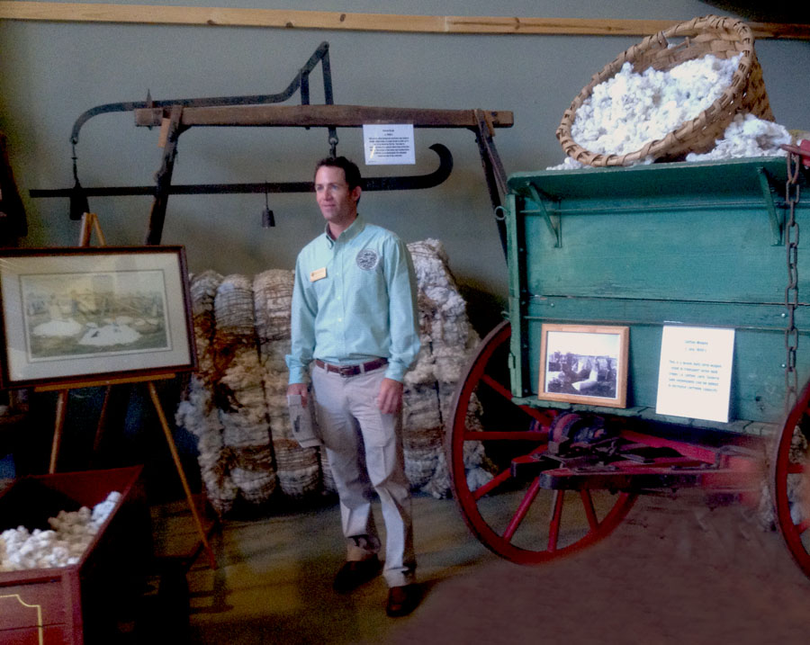 Garret Boone explains the use of old farming machinery at the Georgia Agiriama