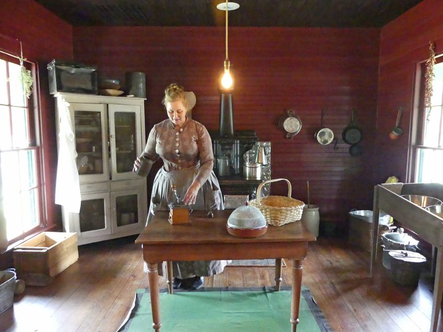 Docent in kitchen at Nash Farm