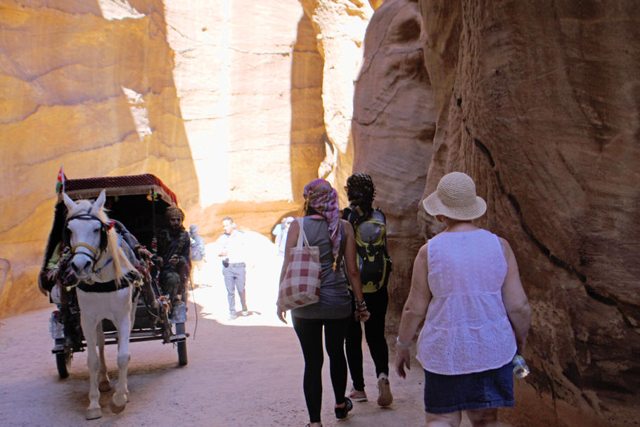 visitors and carriage in siq at Petra