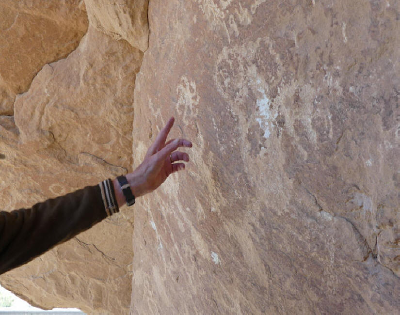 Jim points out Kokopelli on rock in Canyon of the Ancients near Utah border