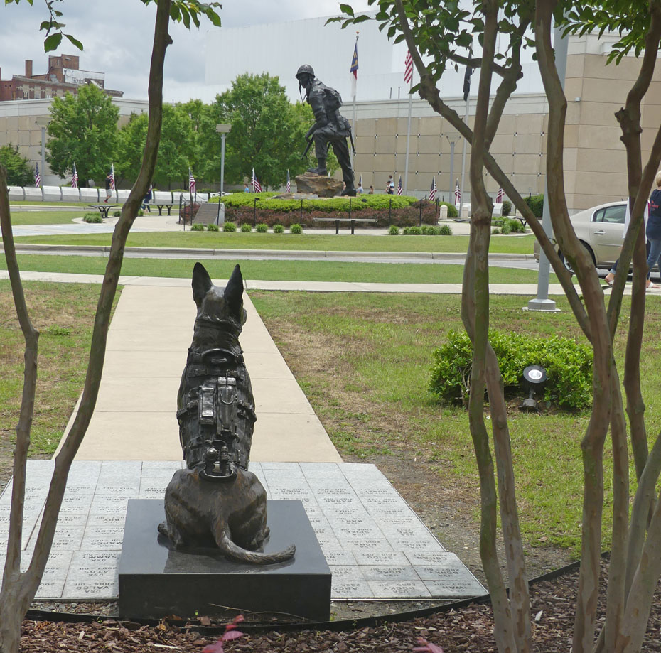 Stature of k9 dog and soldier at entrance to Fort Bragg's 82nd Airbourne Musuem