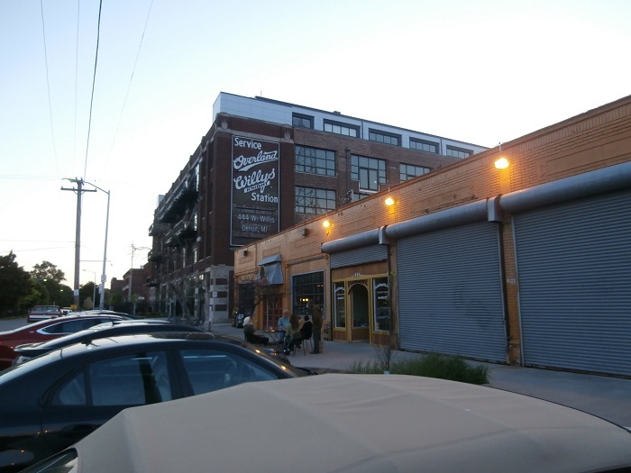 Relaxing outside a local store in Detroit's Cass Corridor signals a resurgent neighborhood