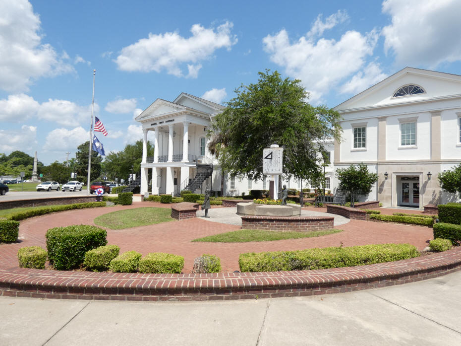 sundial with courthouse in background