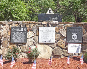 flags in front of plaques honoring airmen