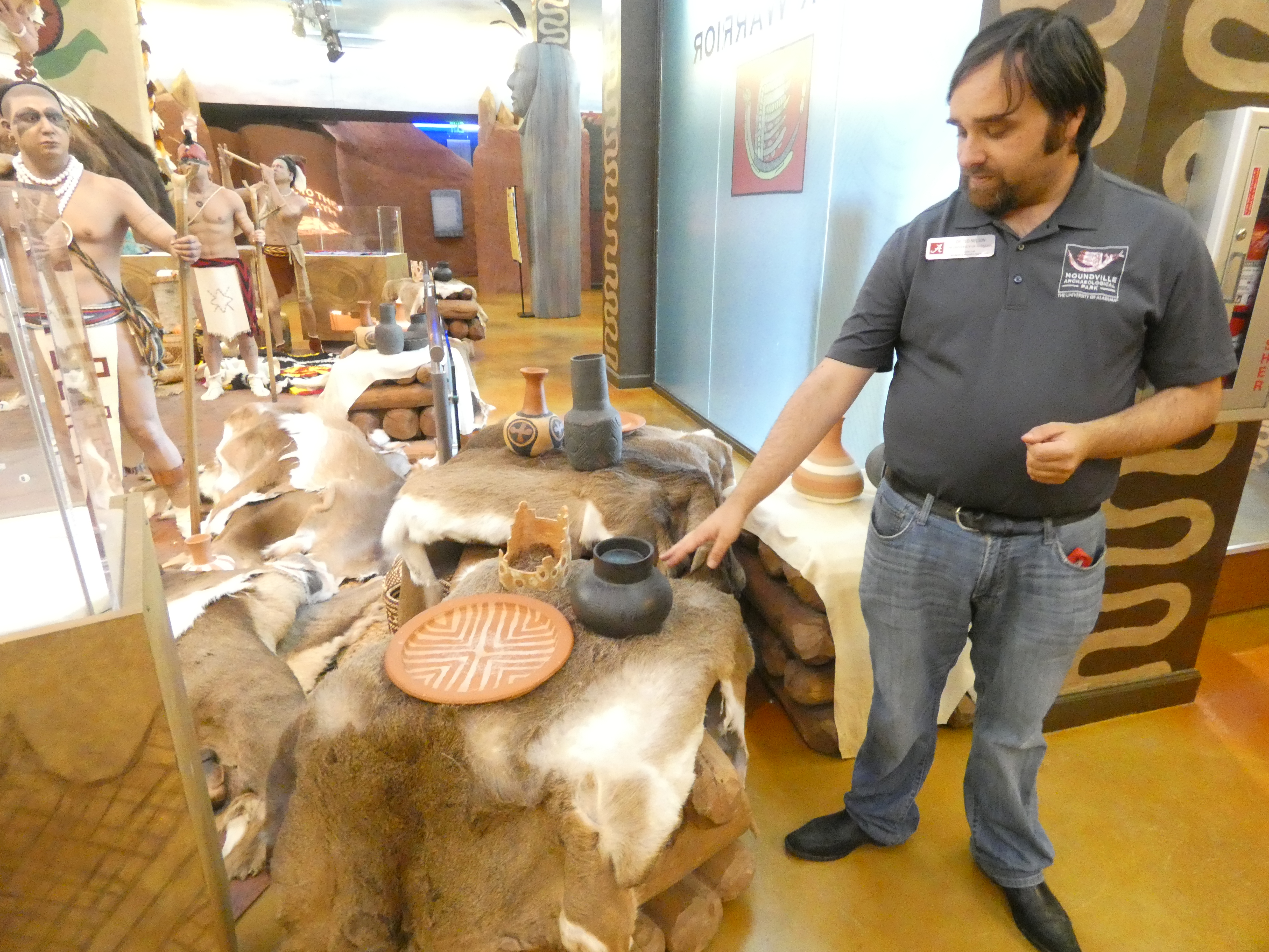 Dr. Nelson shows me some of the pottery in the museum