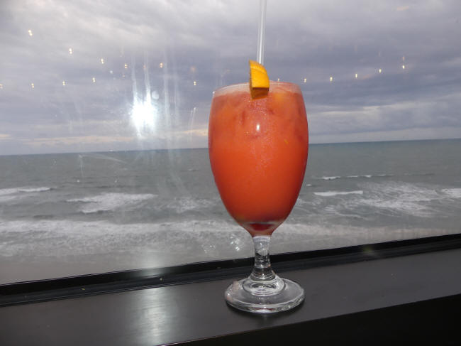 drink with ocean view behind it