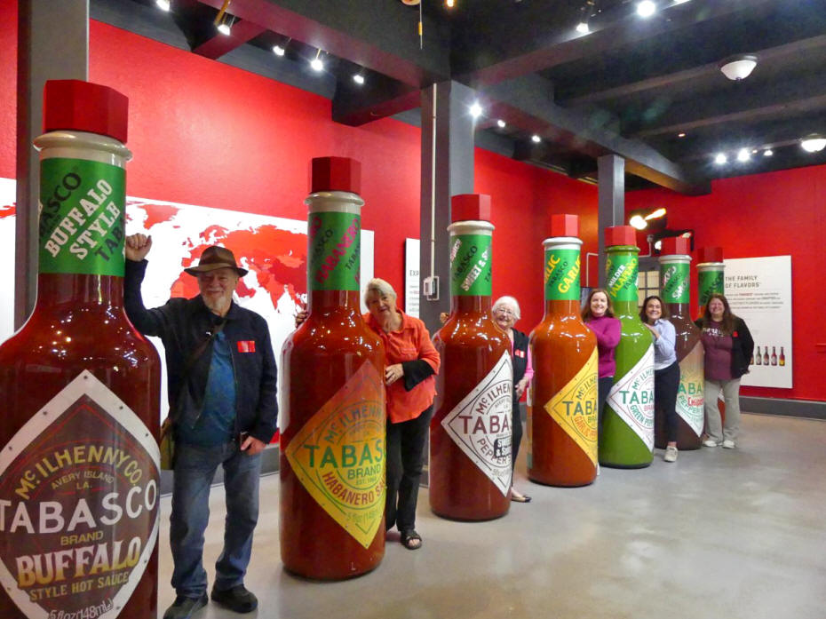 tabasco bottles human sized wiht people by them