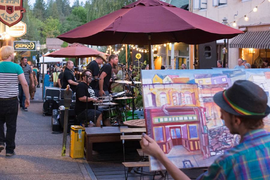 Local artist Kyle Kingston live paints to the music of MAU at The Nevada City Boardwalk