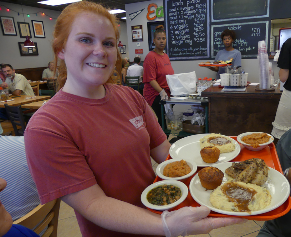 Server with a tray of food at Johnny's