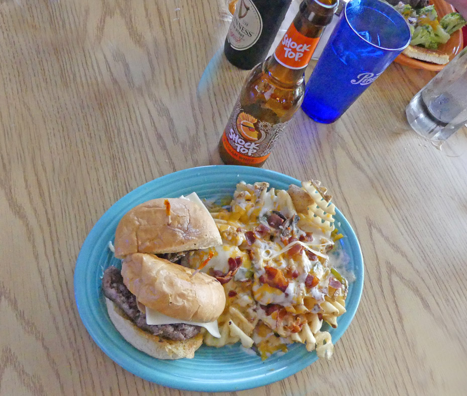 burger and waffle fries at Oslo's Spirits and grill