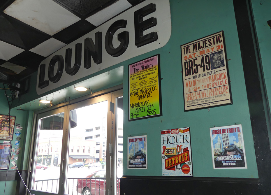 wall in Majestic with posters about bands