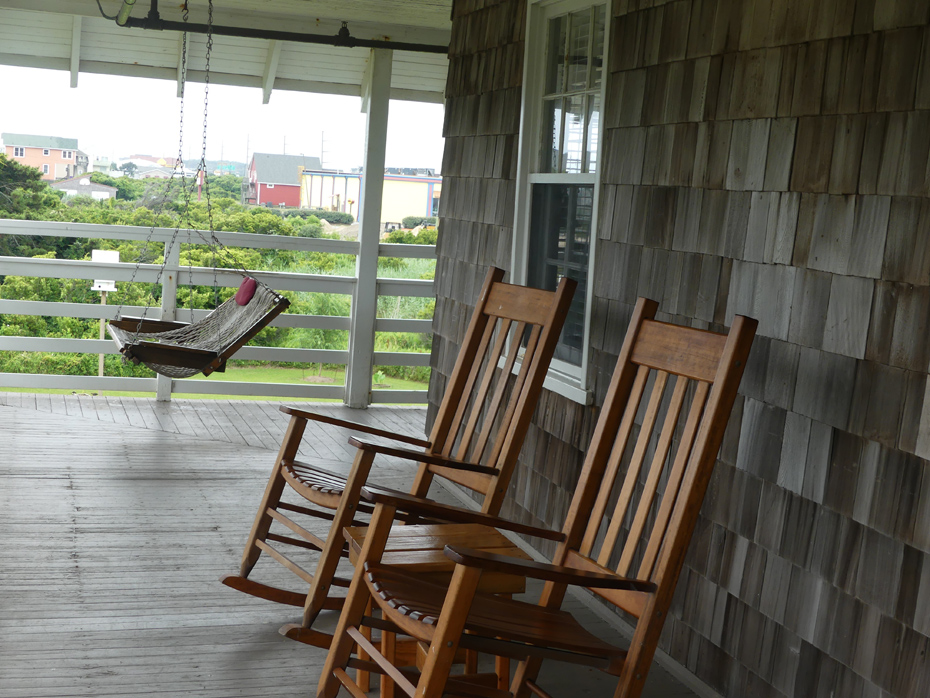 Veranda wiht two rockers and a swing at First Colony Inn