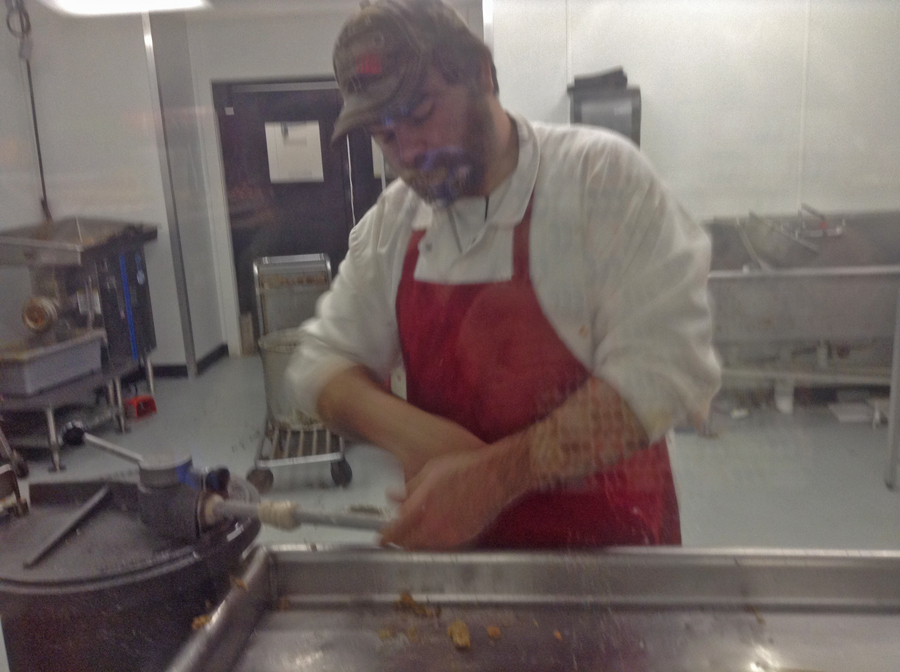 Matthew Fruge preparing to stuff boudin at Lebleus Landing in Sulpher, LA