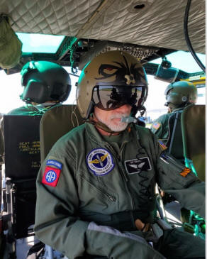 Men inside Huey Heliocopter