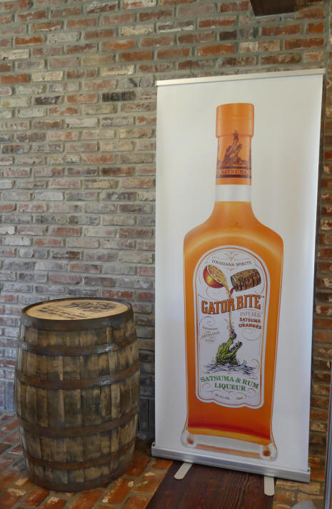 cutout of rum bottle next to barrel