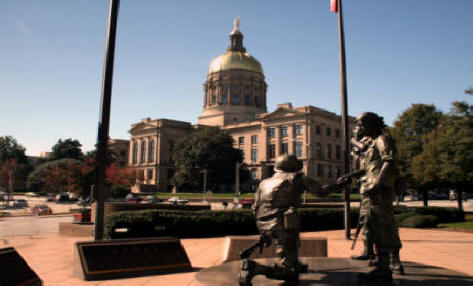 <h1>Atlanta capitol building with veterans statures</h1> in foreground