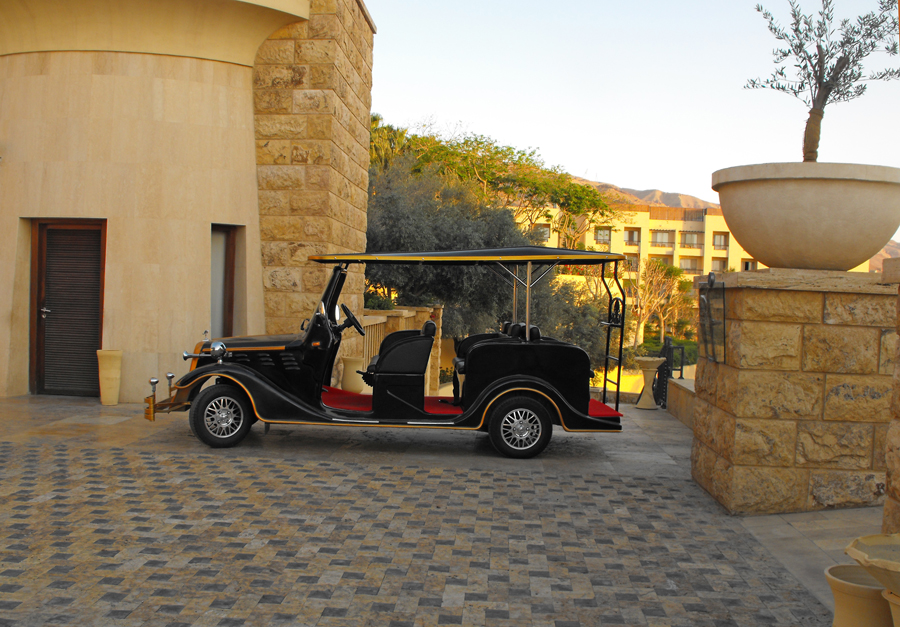 Golf cart decked out like model T  at Kempinsky Hotel Isthar by Dead Sea