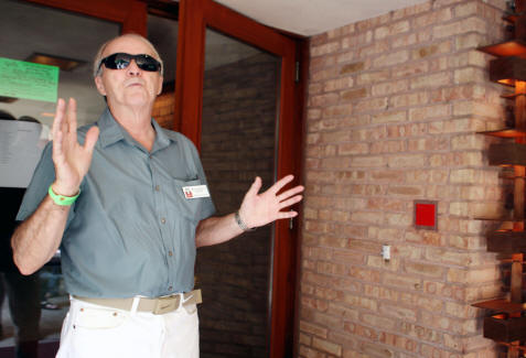 Jerry Heinzeroth standing in the doorway of the Laurent House in Rockford, Illinois