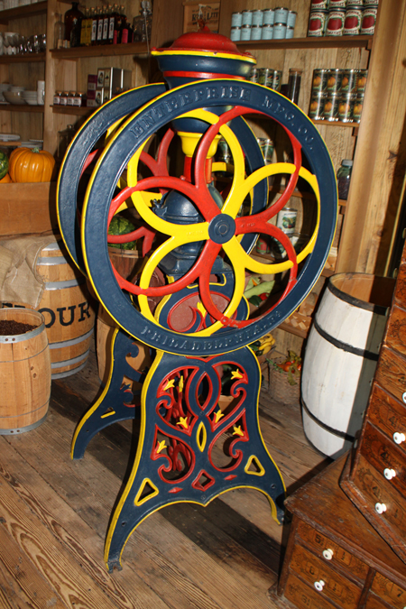Mayborn Musuem in Waco, Texas exhibit showing antique grinder in Bill and Vara Daniels Historic Village