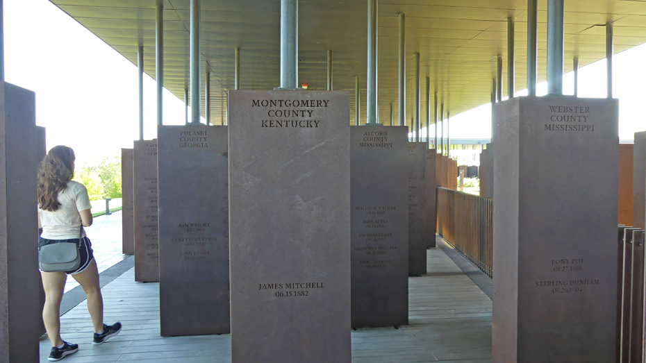 some of the markers shwoing lynched persons in each county at National Memorial for Peace and Justice