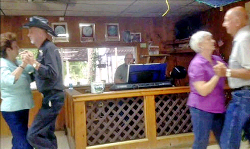 two Couples on dance floor at Bayou Delight in Houma, LA with Larry White playing Cajun or Zydeco music