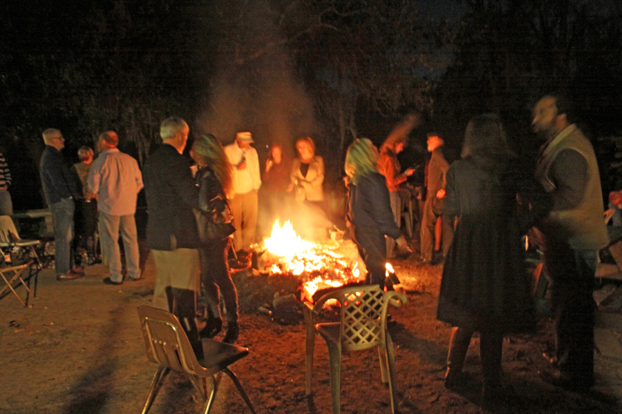 Crowd gathered around bonfire behing Bradfordville Blues Club in Tallahassee