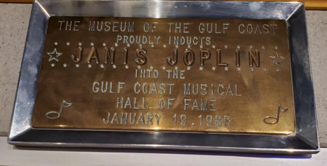 plaque of janis joplin;s inductionint gulf coast musical hal lof fame at museum