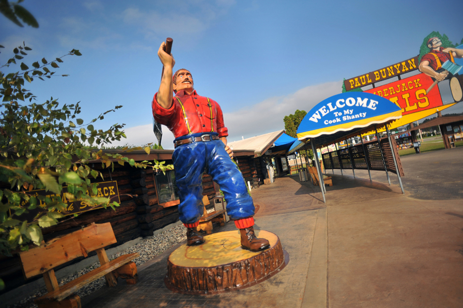 stature of Paul Bunyan in front of cook shanty