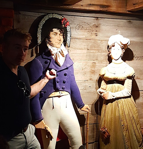 display of a man and woman manaqens in antebellum costume