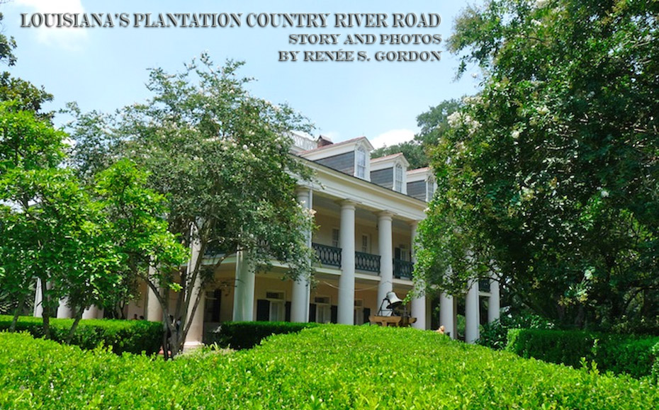 white plantation home with bushes around it.