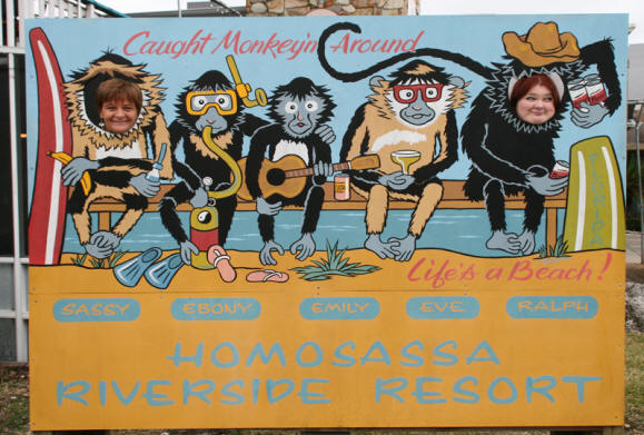 Women pose in sign at  Riverside Crab House in Homosassa, Florida