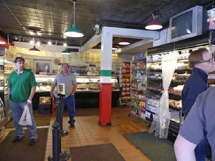 Customer browse Sunseri's Deli on the Strip