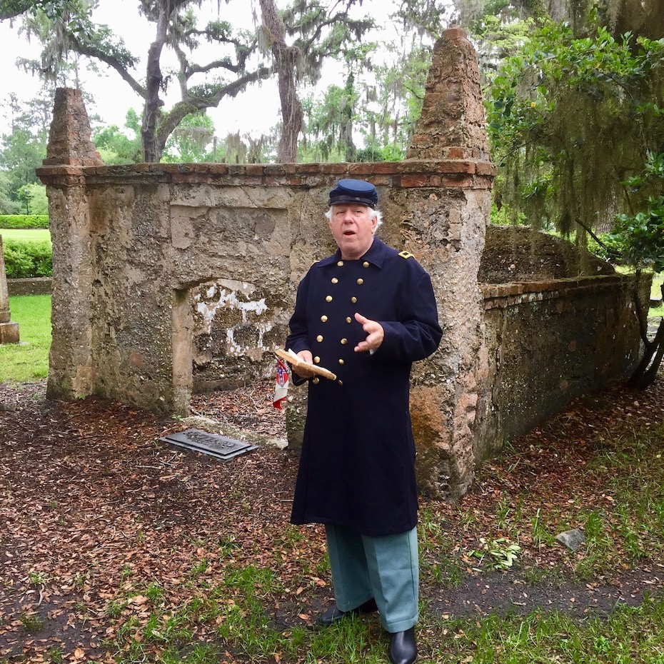 Confederate reenactor in front of tomb at Simons Island cemetery at Christ Church.