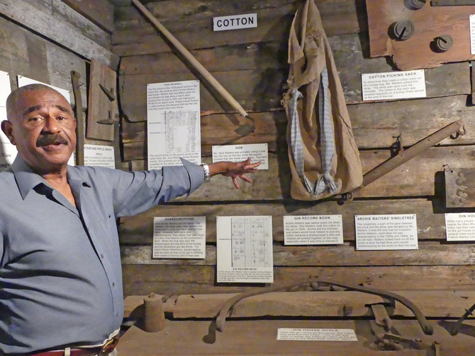 Karl shows tools used to harvest cotton