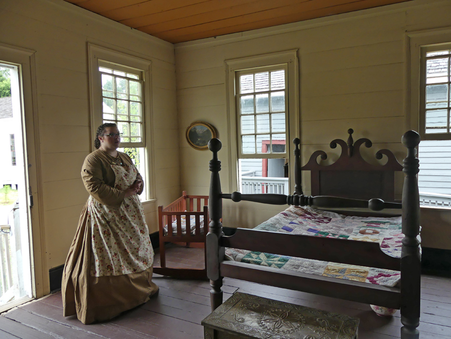 docent shows 19th centurey bedroom at westville
