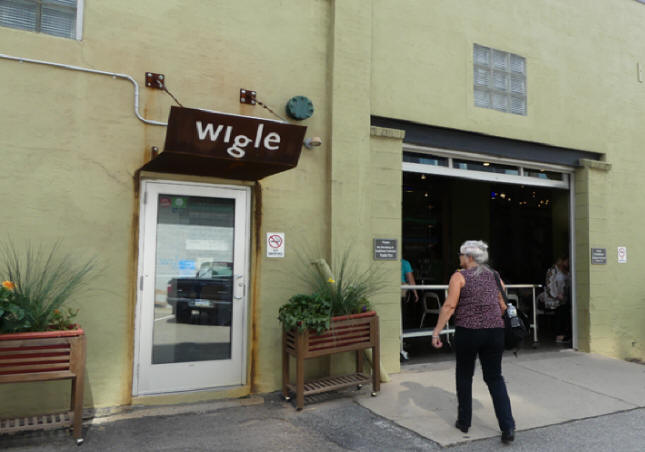 visitor entering Wigle Whiskey in Pittsburgh